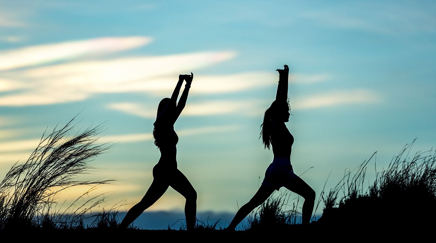 A peaceful outdoor yoga practice at dusk